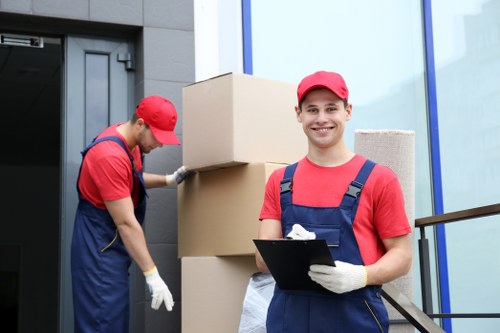 Student removals planning in Acton with boxes and furniture near a local property