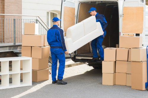Furniture and boxes being loaded by removalists in Acton