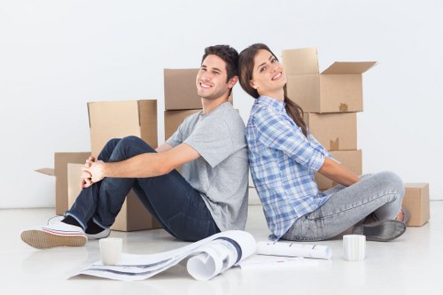 Local movers handling boxes and furniture for an Acton property