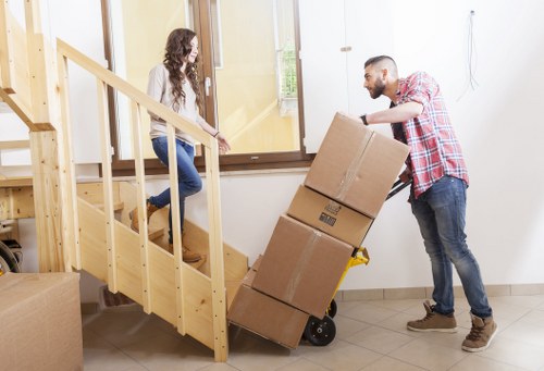 Packed furniture and cartons ready for same day removal service in Acton